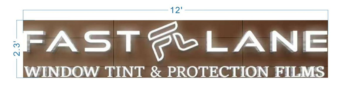 Illuminated FAST LANE sign with stylized F and WINDOW TINT & PROTECTION FILMS text on brown wood, marked 12'×2.3'.