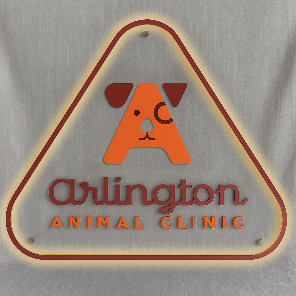 Triangular illuminated sign with orange dog-face 'A' logo, 'arlington' script and 'ANIMAL CLINIC' text on gray fabric.