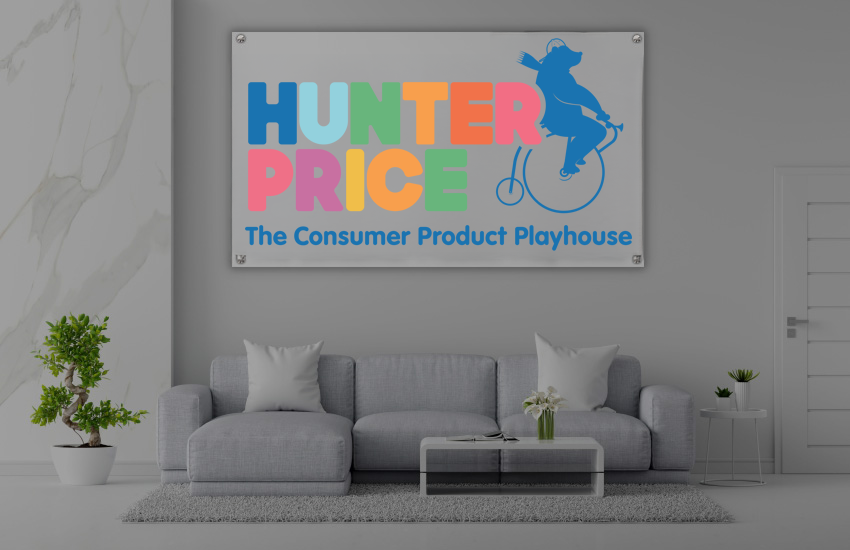 Gray living room with sofa, coffee table, plants and colorful HUNTER PRICE sign reading The Consumer Product Playhouse.