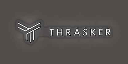 Neon white "THRASKER" lettering on a dark gray wall with soft glow and an abstract geometric Y logo of three bars.