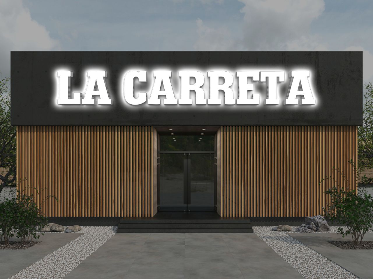 Modern storefront with glowing white 'LA CARRETA' sign on dark facade above vertical wood slats, glass double door.