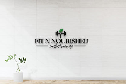 Black 3D "FIT N NOURISHED with Amanda" logo with dumbbell icon and green leaf on white tiled wall above glass-vase.
