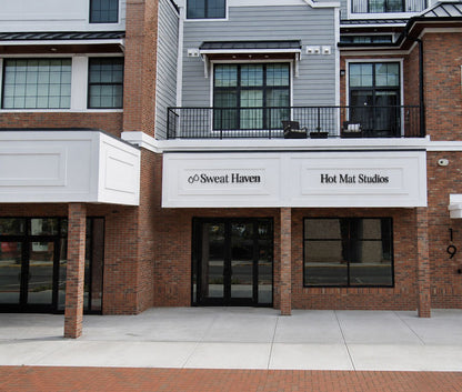 Custom black metal channel letter signs for Sweat Haven and Hot Mat Studios by Volt Signs design experts.
