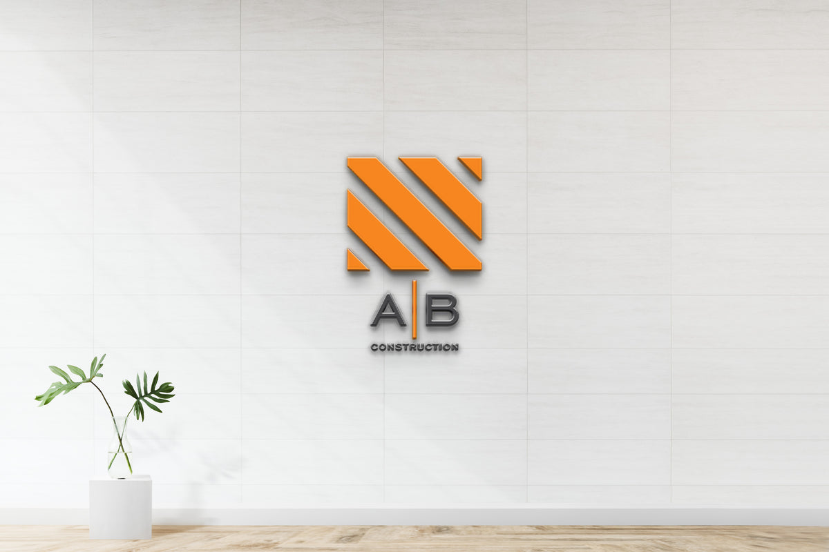 Orange diagonal-striped logo above 'A|B CONSTRUCTION' text on white tiled wall, glass vase plant left.
