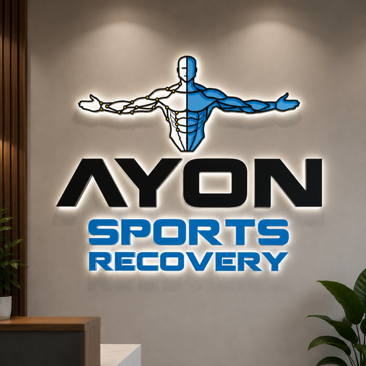 Backlit custom 3D wall sign for Ayon Sports Recovery with black and blue lettering and a human figure logo by Volt Signs