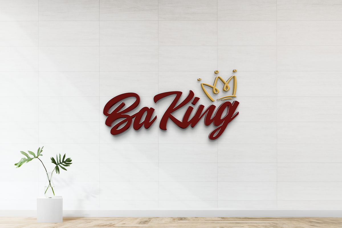 Maroon cursive 'Ba King' sign with gold crown mounted on white tiled wall, green monstera in glass vase.