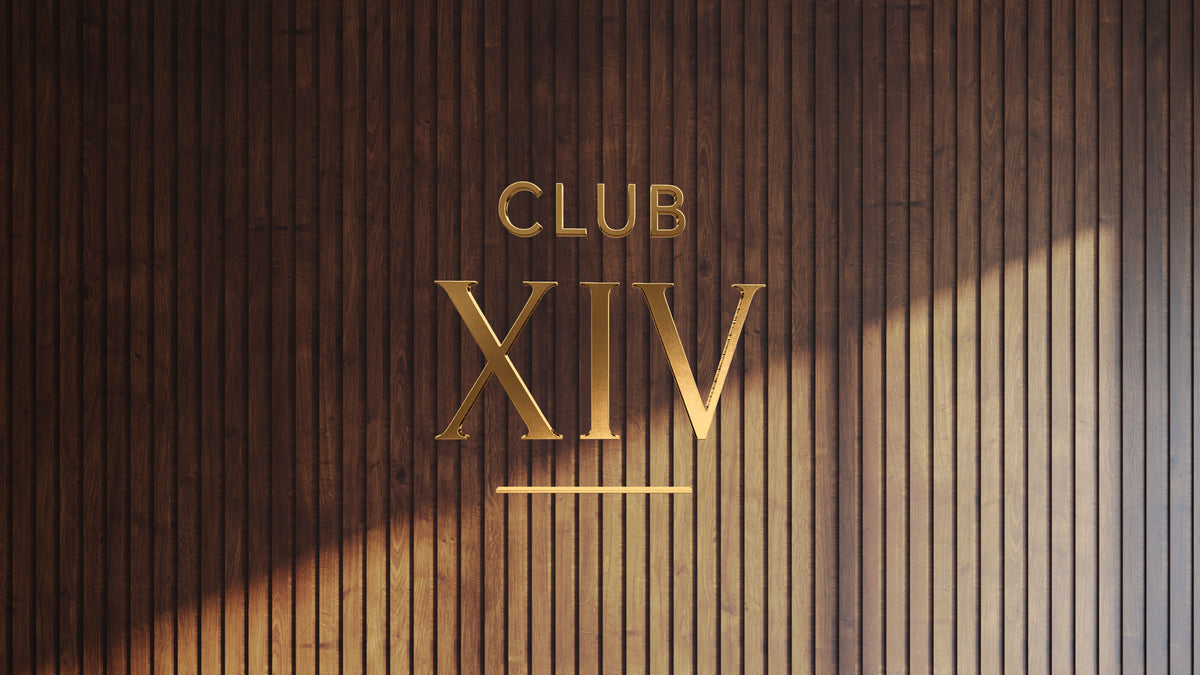 Non-lit 3D gold metal custom sign mockup reading Club XIV mounted on vertical dark wood slat wall by Volt Signs