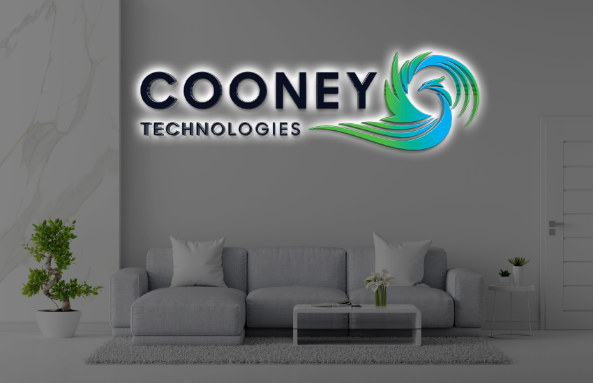 Illuminated Cooney Technologies logo with green-blue swirl above grey sofa, glass coffee table and plants.