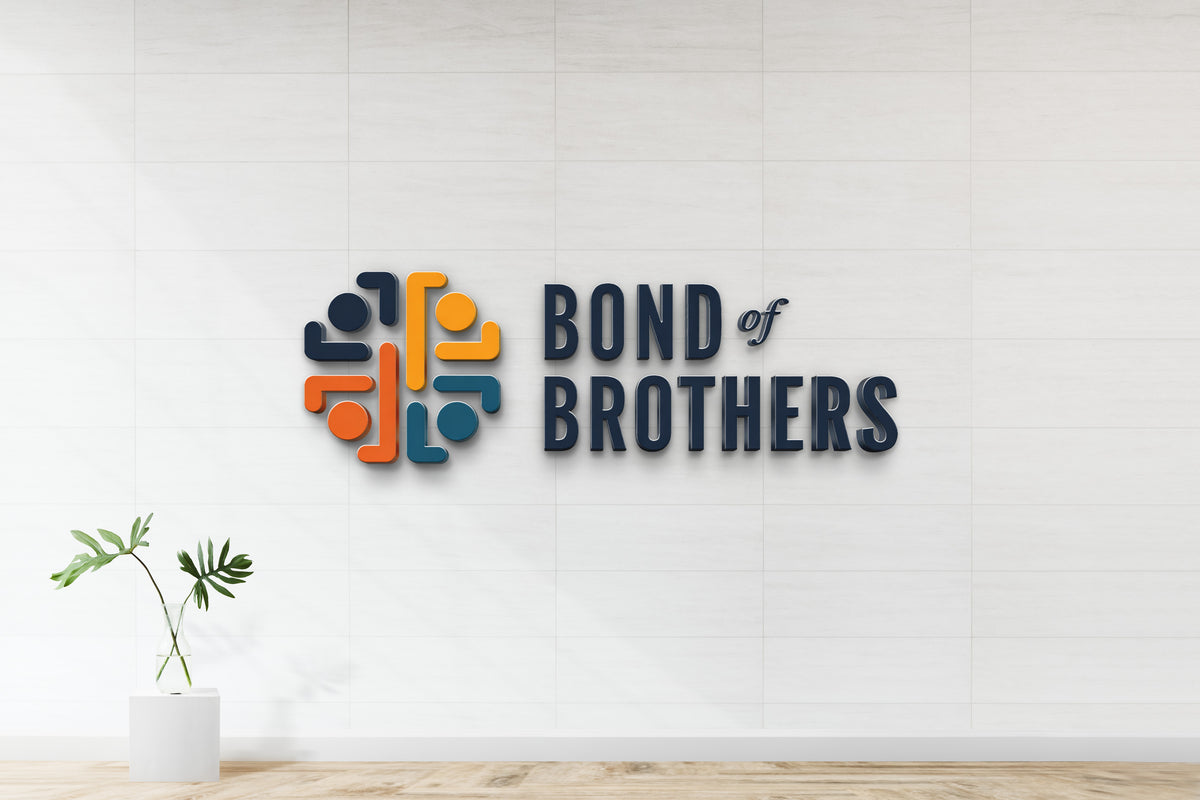 Wall-mounted 'BOND of BROTHERS' navy 3D letters with circular orange, yellow, teal and navy emblem; glass vase plant.