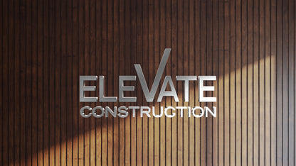 Silver 3D letters reading 'ELEVATE CONSTRUCTION' centered on lower area against vertical dark brown wooden slat wall.
