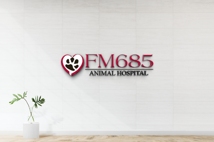 White tiled wall with red FM685 logo and heart paw above ANIMAL HOSPITAL, vase with green leaves on pedestal.