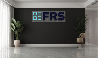 Modern custom acrylic wall sign with blue and black lettering mounted on black wall in office lobby by Volt Signs