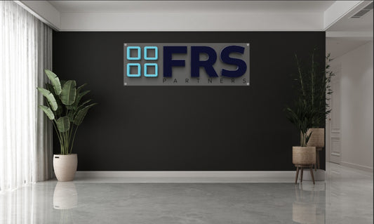 Modern custom acrylic wall sign with blue and black lettering mounted on black wall in office lobby by Volt Signs