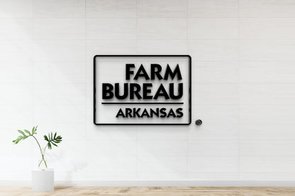 Farm Bureau Arkansas 3D logo sign mockup with rounded rectangle border, nonlit dimensional letters on office wall with elegant tile finish.