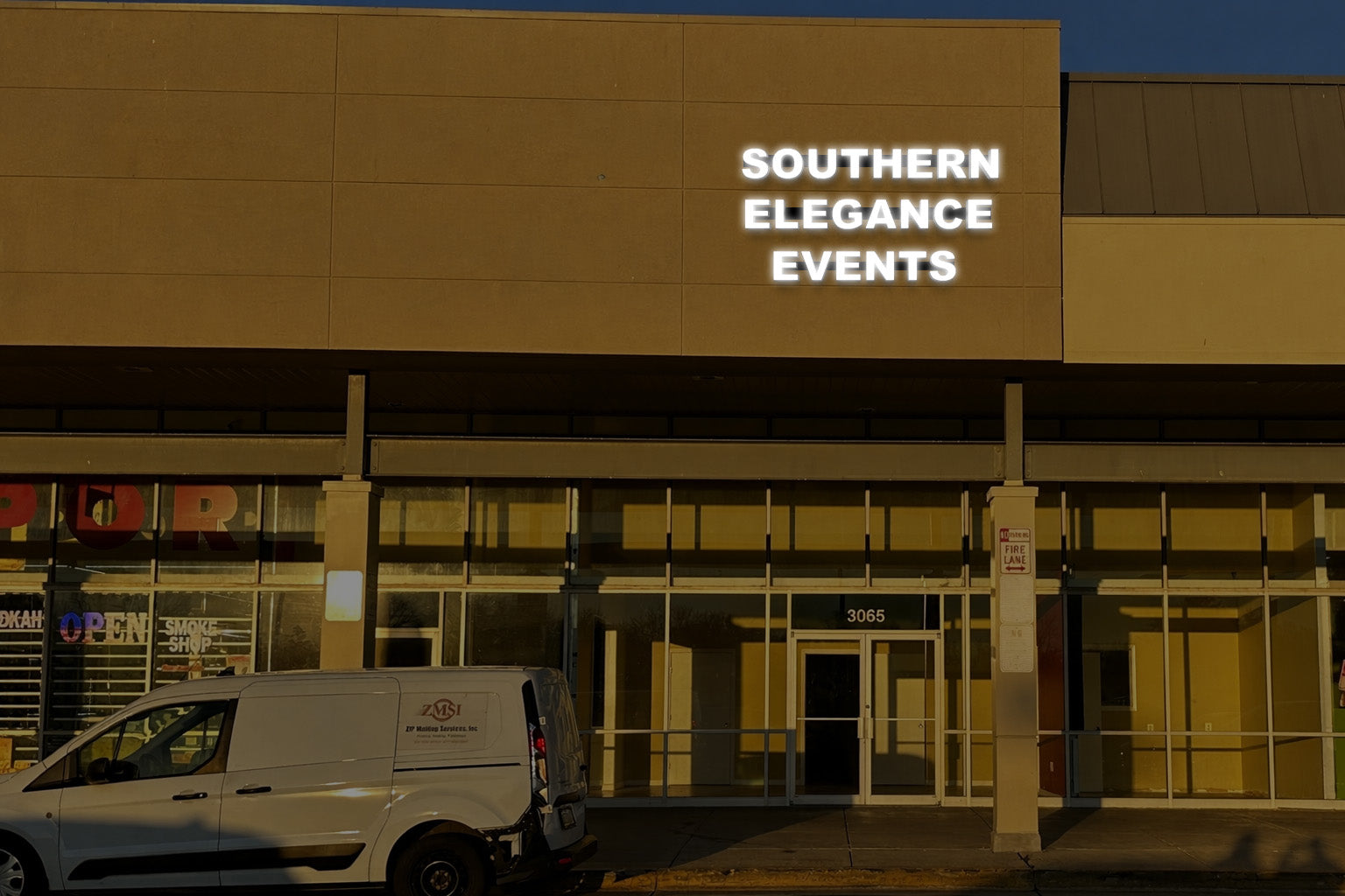 Southern Elegance Events real installed storefront sign with face-lit white LED channel letters on tan facade above shopping center entrance.