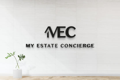 Modern black 3D custom wall sign for My Estate Concierge on white tile wall with minimal plant decor by Volt Signs