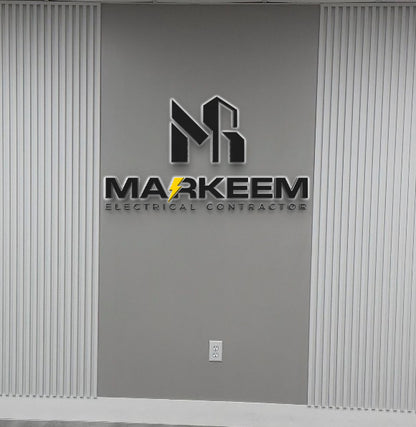 Markeem Electrical Contractor logo with yellow lightning bolt on gray wall between white slats above outlet.