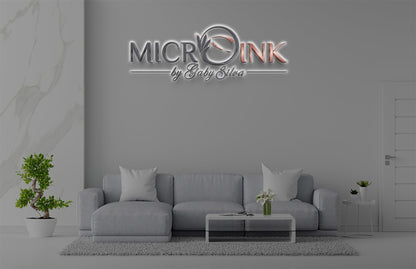 Microink by Gaby Silva 3D halo backlit logo sign with silver and rose gold lettering and feather emblem on lounge wall mockup, microblading studio.