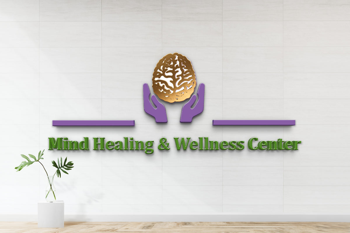 Gold brain held by purple hands logo above green Mind Healing & Wellness Center text on white tiled wall with glass.