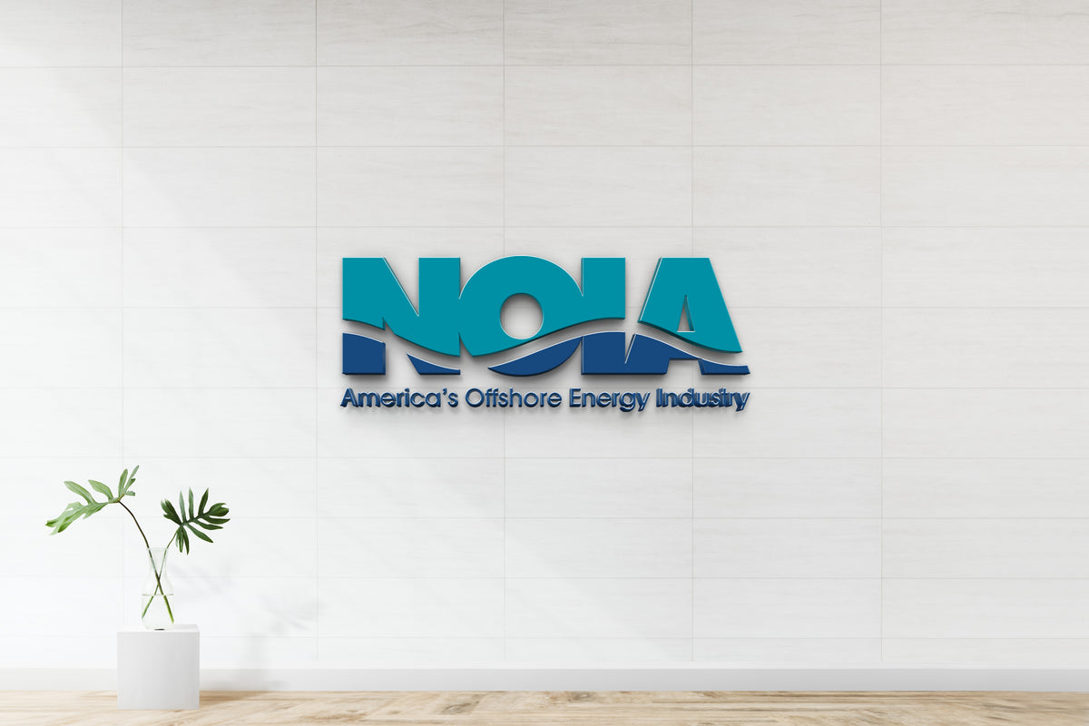 Teal and navy NOIA wave logo with text 'America's Offshore Energy Industry' on white tiled wall above monstera.