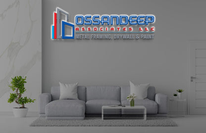 Custom Ossandeep Associates LLC 3D halo-lit logo sign by Volt Signs, cyan and red lettering with building icon for construction contractor.