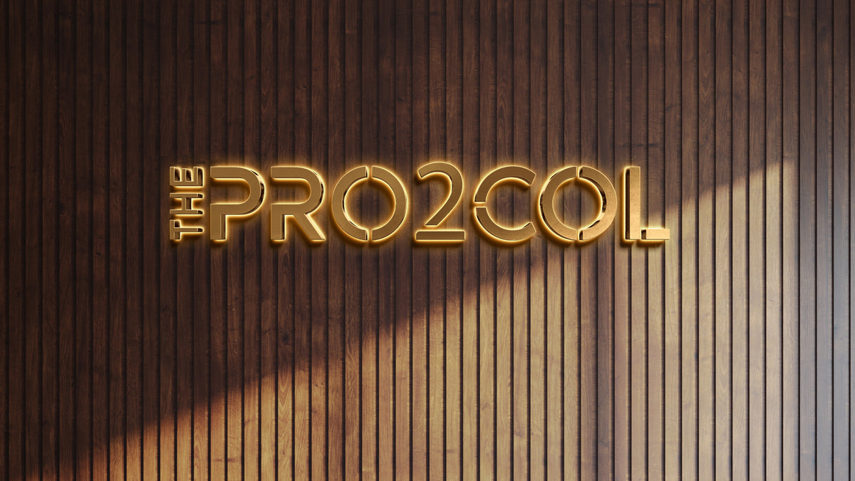 Illuminated custom wall sign reading THE PROTOCOL with gold lighting on vertical wooden paneling backdrop by Volt Signs.