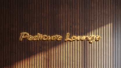 Illuminated gold script sign reading Pedicure Lounge mounted on dark vertical wooden slat wall with soft shadows.