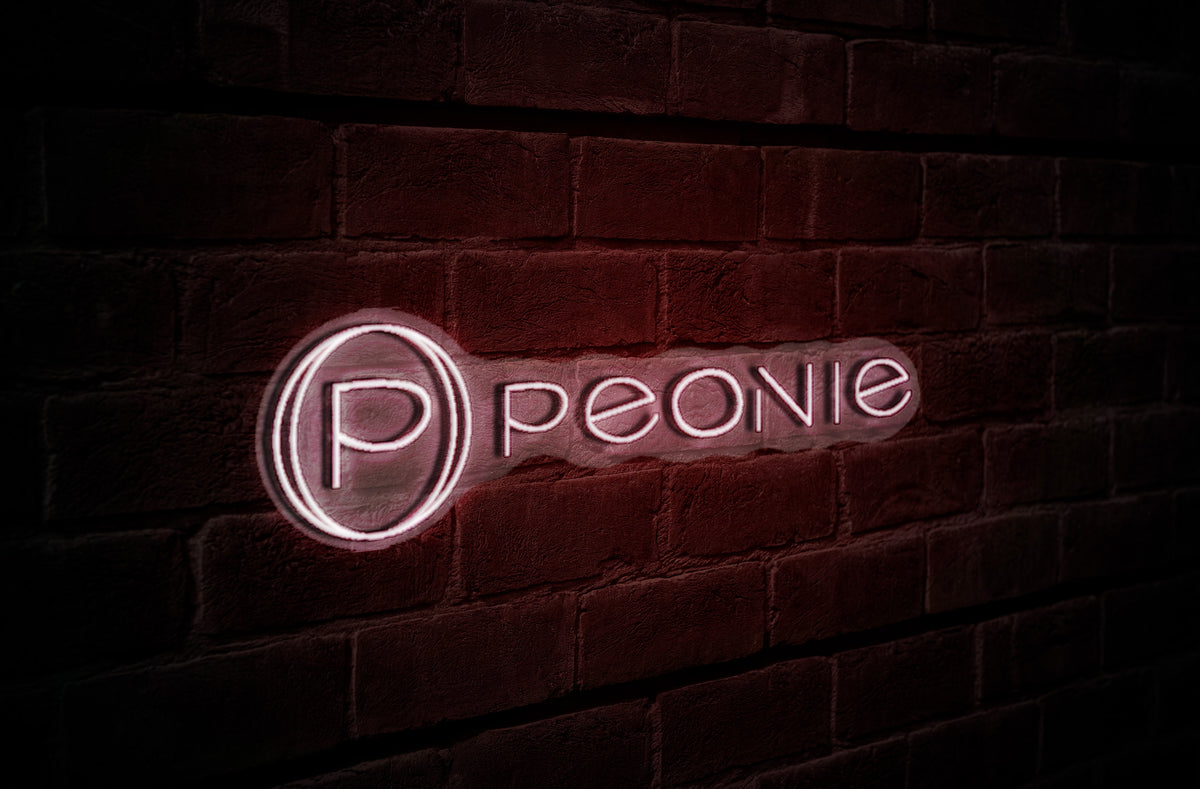 Pink neon circular 'P' logo and 'peone' lettering glowing on textured dark red brick wall at night.
