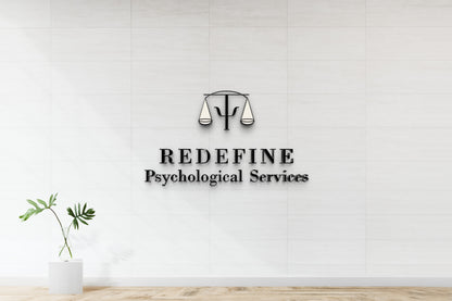 White tiled wall with black scales-and-psi logo above bold 'REDEFINE Psychological Services' text; glass vase plant l.