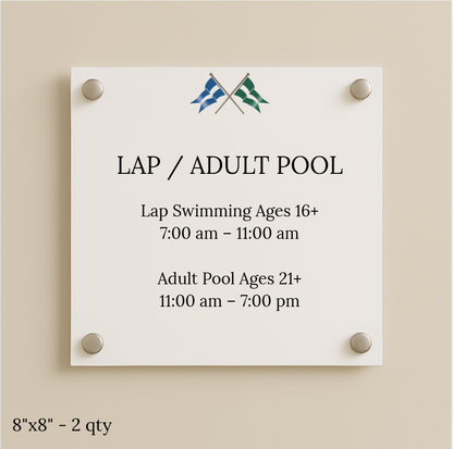 White sign on beige wall 'LAP / ADULT POOL' with crossed blue/green flags; lap 16+ 7–11am, adult 21+ 11am–7pm.
