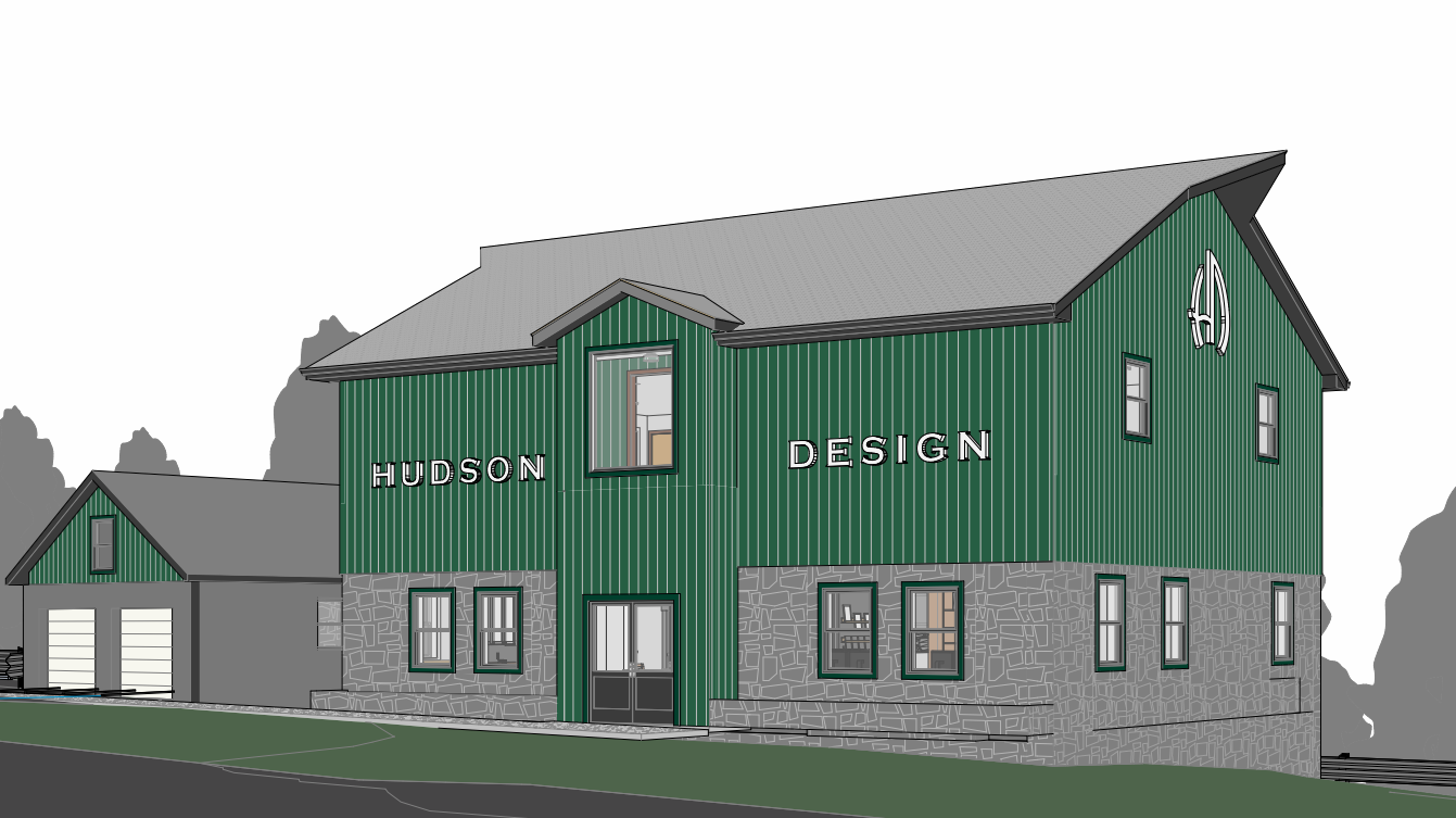 3D building mockup with custom exterior signage reading Hudson Design in white letters on green metal siding by Volt Signs.