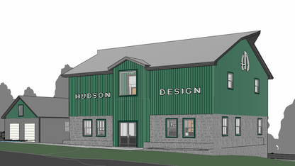 3D building mockup with custom exterior signage reading Hudson Design in white letters on green metal siding by Volt Signs.