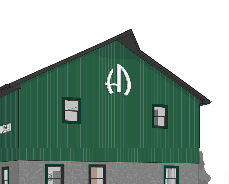 Custom white 3D logo signage mounted on green vertical paneling above windows on commercial building facade by Volt Signs.