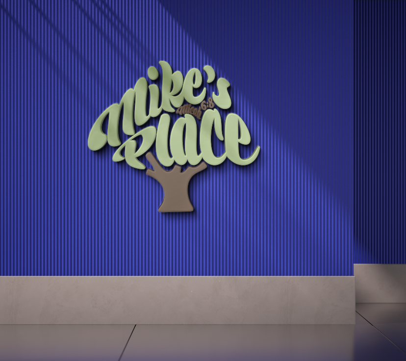 3D pale green script logo reading 'Mike's Place' shaped like a tree with brown trunk on ribbed royal-blue wall.