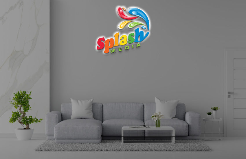 Splash Media 3D halo backlit logo sign with rainbow paint splash design on office wall, multi-color media company branding mockup.