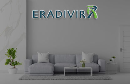 Modern living room with a gray sofa and Volt Signs ERADIVIR custom sign and signage displayed above the couch