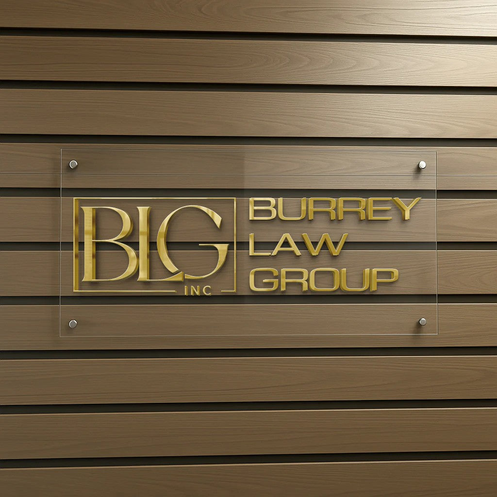 Acrylic wall sign with gold 'BIG Inc' logo left and 'BURREY LAW GROUP' gold lettering on brown horizontal wood paneling.