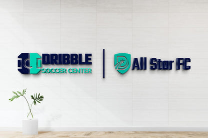 Custom Dribble Soccer Center and All Star FC 3D dimensional dual logo signs by Volt Signs in navy and teal with shield emblems on tile wall.