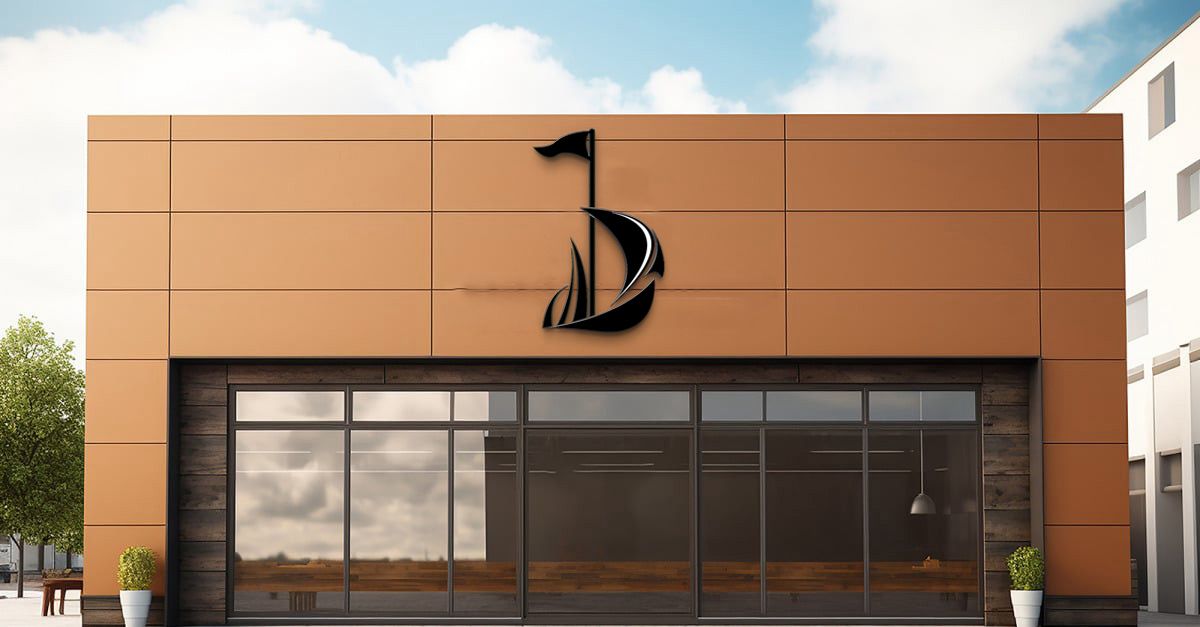 Modern storefront with large glass windows, rust-orange panel facade and black sailboat logo above entrance.