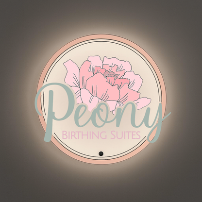 Wall-mounted round illuminated sign with pink peony illustration, teal 'Peony' script and pink BIRTHING SUITES.